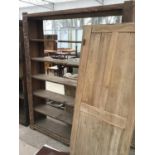 A VINTAGE SIX SHELF SHELVING UNIT WITH DOORS DOORS