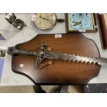 AN 'ANCIENT WARRIOR' DECORATIVE SWORD WITH WOODEN WALL MOUNT