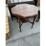 A MAHOGANY OCCASIONAL TABLE WITH LOWER SHELF
