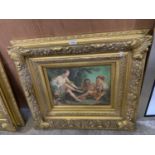 A LARGE GILT FRAMED DECORATIVE PRINT