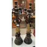 A PAIR OF FRENCH GILT AND BRONZE FIGURAL CANDLE STICKS, SIGNED TO BASE
