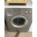 AN INDESIT SILVER WASHING MACHINE IN WORKING ORDER