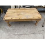 A RECTANGULAR OAK COFFEE TABLE DECORATED WITH IRON STUD AND BANDING