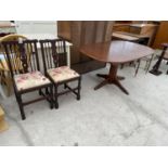 TWO OAK DINING CHAIRS AND A MAHOGANY DINING TABLE