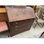 A GEORGIAN OAK BUREAU ON BRACKET FEET WITH FALL FRONT AND FOUR LONG DRAWERS