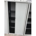 A METAL STORAGE CABINET WITH SLIDING DOOR AND INNER SHELVING