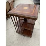 AN INLAID MAHOGANY CANTERBURY STYLE BOOKCASE ON SWIVEL BASE