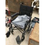 AN AS NEW INVACARE BEN 9 MANUAL WHEELCHAIR WITH CUSHION