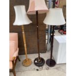 THREE STANDARD LAMPS - ONE OAK, TWO MAHOGANY