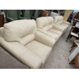 A CREAM LEATHER THREE SEATER SOFA, TWO SEATER SOFA AND ARMCHAIR (AS NEW)
