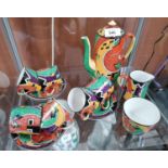 A HAND PAINTED ART DECO 1930'S TEA SET IN AN ORANGE, RED AND GREEN BIZARRE STYLE PATTERN