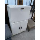 A VINTAGE KITCHEN CABINET WITH FALL FRONT, TWO DOORS, TWO SMALL INNER DRAWERS AND ENAMEL WORK