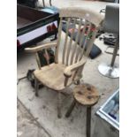 A VINTAGE PINE FARMHOUSE CARVER CHAIR AND A THREE LEGGED MILKING STOOL