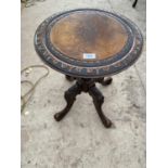 A VICTORIAN CARVED WALNUT WINE TABLE ON ELABORATE PEDESTAL SUPPORT