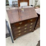 A GEORGIAN OAK BUREAU ON BRACKET FEET WITH FALL FRONT REVEALING BAIZE WRITING SURFACE AND VARIOUS