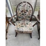 AN ERCOL ELM ROCKING CHAIR