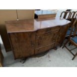 A WALNUT SIDEBOARD WITH TWO DOORS AND FOUR DRAWERS
