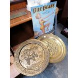 A BILE BEANS METAL SIGN AND TWO VINTAGE BRASS CHARGERS
