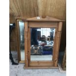 A PINE FRAMED MIRROR WITH COLUMN SIDES AND AN ORNATE GILT FRAMED MIRROR