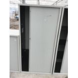 A METAL STORAGE CABINET WITH SLIDING DOOR AND INNER SHELVING