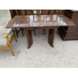 A MAHOGANY DRAW LEAF DINING TABLE