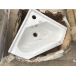 AN AS NEW AND BOXED VICTORIA PLUMB WHITE CORNER WASH BASIN VCB1001
