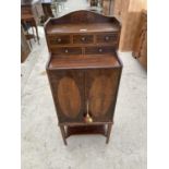 A SMALL VICTORIAN INLAID MAHOGANY CABINET WITH TWO DOORS, FIVE SMALL DRAWERS AND LOWER SHELF