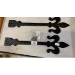 A PAIR OF BLACK CAST GATE HINGES