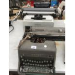 A VINTAGE ROYAL TYPE WRITER AND A OLIVETTI LINEA 98 TYPE WRITER