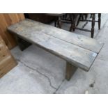 A SMALL RUSTIC PINE BENCH