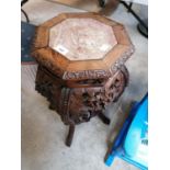 A CARVED WOODEN ORIENTAL JARDINIERE STAND WITH MARBLE TOP