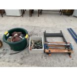 A BLACK AND DECKER WORK BECH, SAW, TUB OF SANDING BELTS/SANDPAPER AND VARIOUS TOOLS