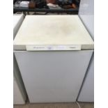 A FRIGIDAIRE COMPACT FREEZER IN NEED OF MINOR CLEAN IN WORKING ORDER