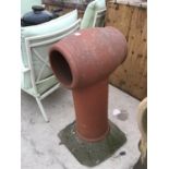 A LARGE RED COLOURED CHIMNEY POT