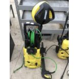 A KARCHER PRESSURE WASHER WITH ATTACHMENTS