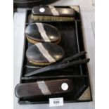 A VINTAGE EBONY AND SILVER BACKED DRESSING TABLE SET