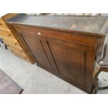 A WALL MOUNTED OAK CABINET WITH TWO DOORS