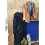 A VINTAGE BLACK FUR COAT WITH BELT AND A SUEDE JACKET WITH ORNATE LAPELS AND POCKETS