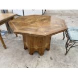 AN OCTAGONAL DINING TABLE WITH PARQUET STYLE TOP AND INLAID DECORATION