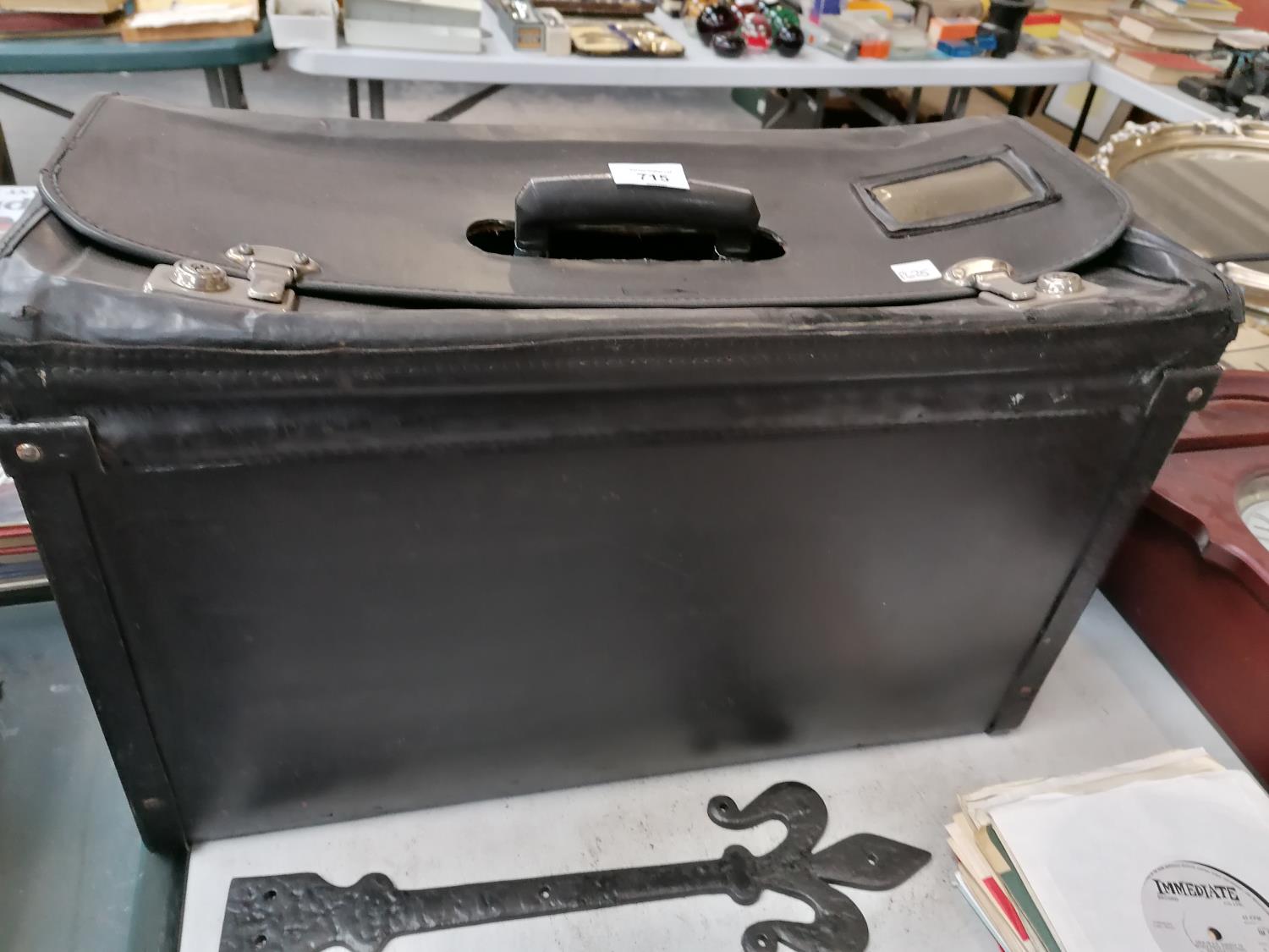 A BLACK BRIEF CASE/ STORAGE CASE