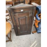 A VICTORIAN OAK FLAT FRONT CORNER CUPBOARD