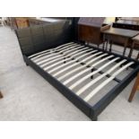 A BLACK LEATHERETTE KING SIZE BED
