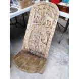 A CARVED WOODEN TRIBAL STYLE TWO PIECE CHAIR / SEAT