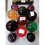 A COLLECTION OF ELEVEN ASSORTED GLASS PAPERWEIGHTS