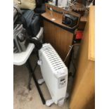 A CORBY TROUSER PRESS AND A DIMPLEX HEATER IN WORKING ORDER