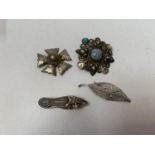 A COLLECTION OF FOUR SILVER BROOCHES