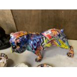 A RESIN MULTI-COLOURED BULL DOG FIGURE