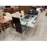 A GLASS TOPPED DINING TABLE ON CHROME SUPPORTS AND SIX HIGH BACKED DINING CHAIRS