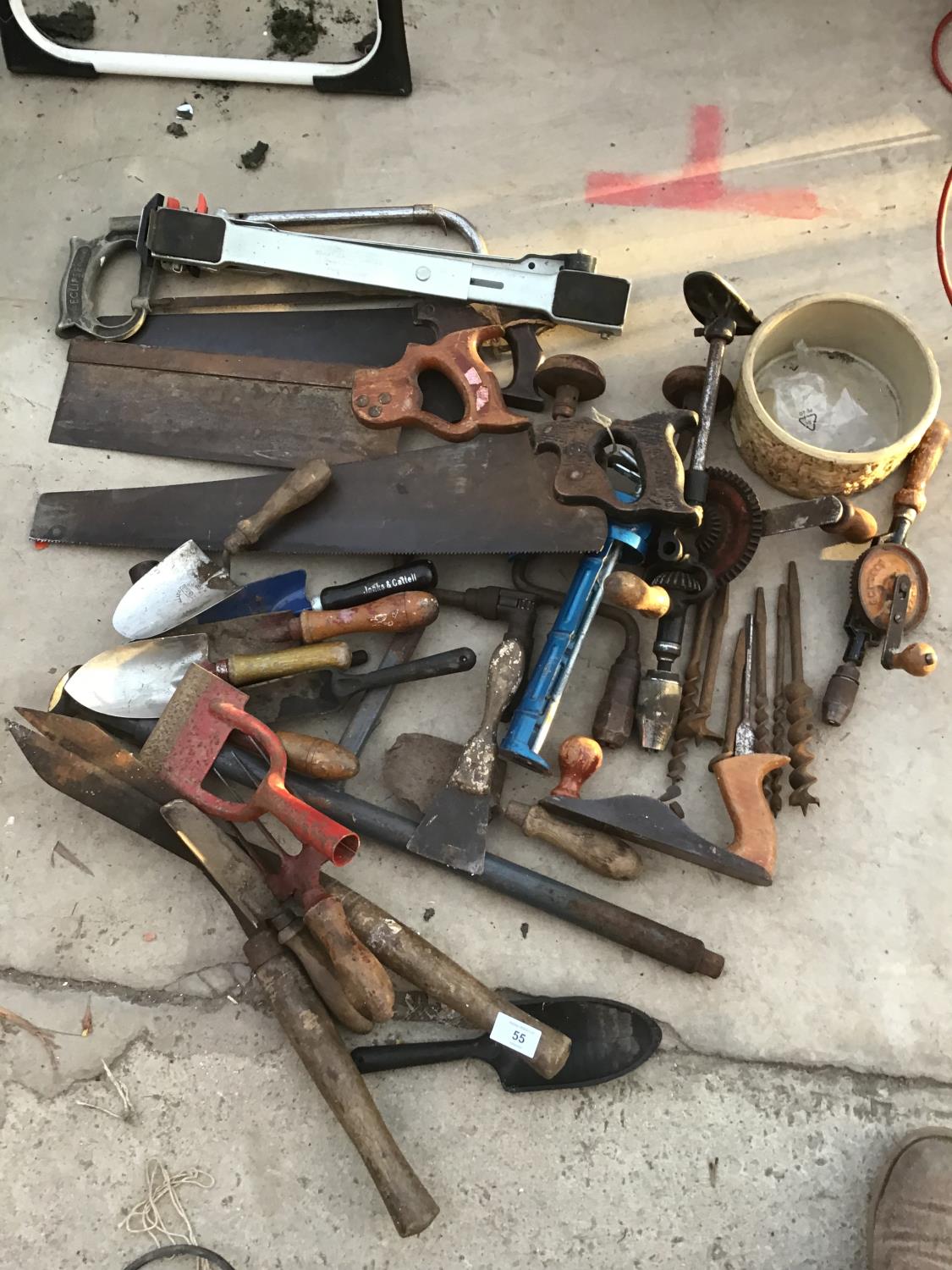 A COLLECTION OF TOOLS TO INCLUDE SAWS, DRILL BITS, TROUGHS, SHEARS ETC