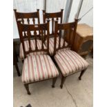 FOUR CARVED MAHOGANY DINING CHAIRS